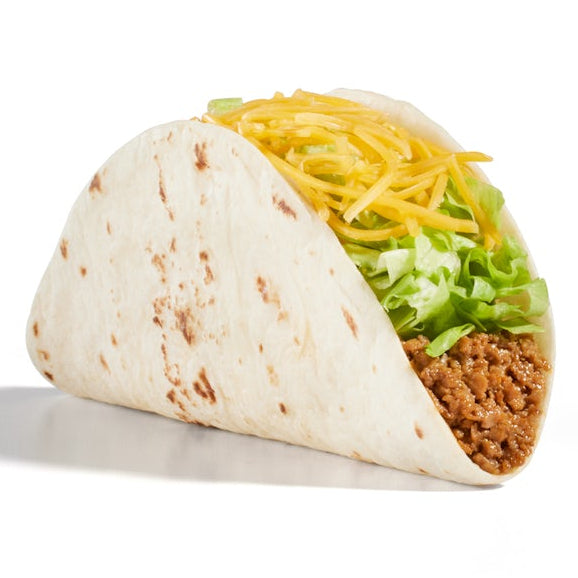 A soft taco filled with ground meat, shredded yellow cheese, and shredded green lettuce.